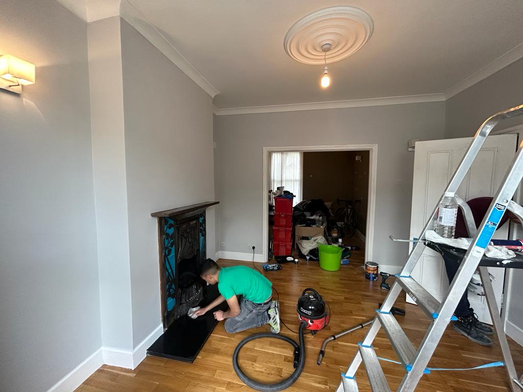 Residential fireplace wall during painting