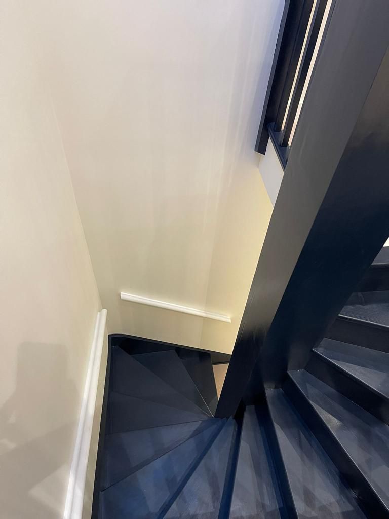 Black staircase and white walls