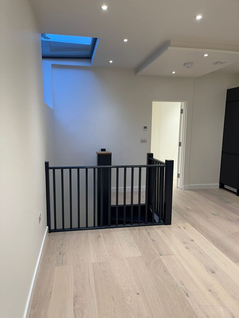 Landing with black stair railing