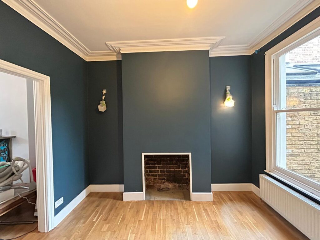 Dark painted living room with fireplace
